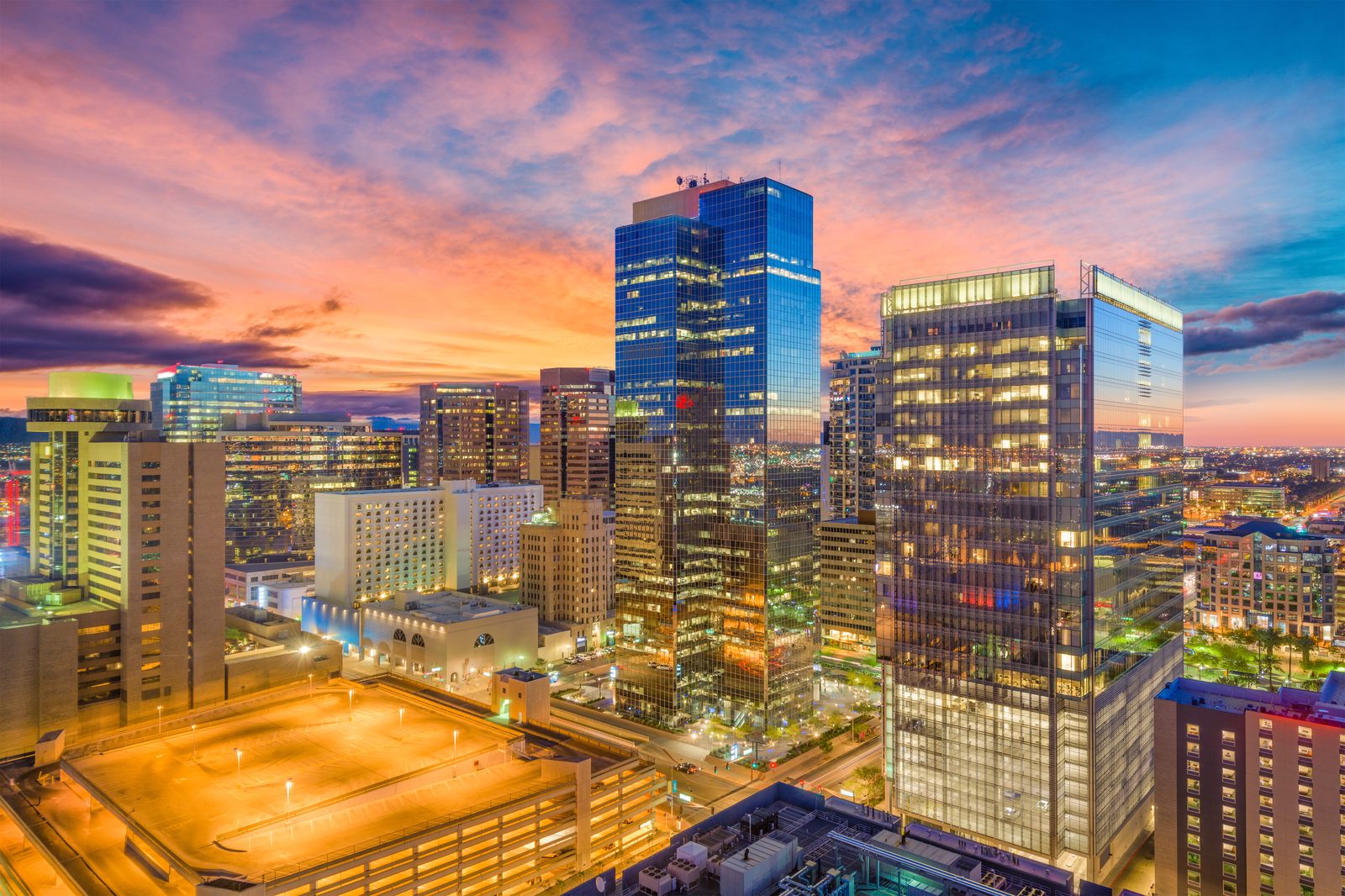 Downtown Phoenix high-rises glowing at sunset from above