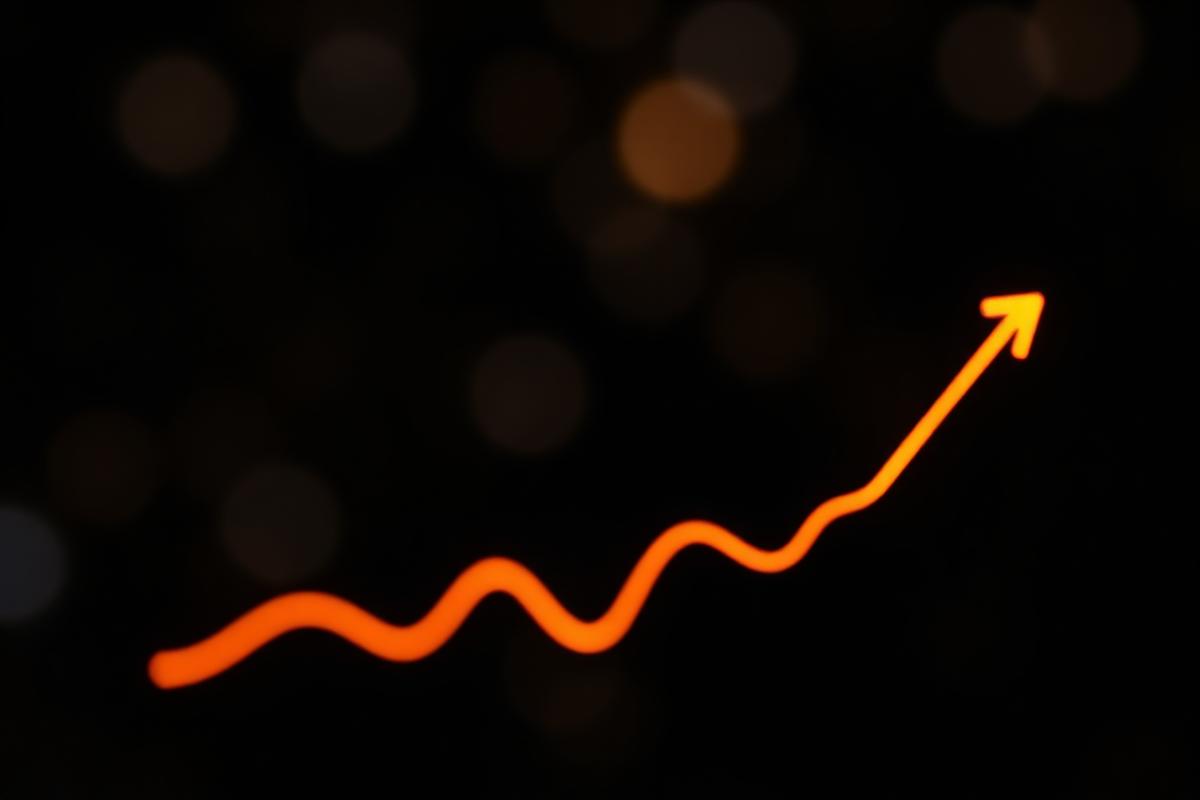 Rising orange light line representing text message program revenue