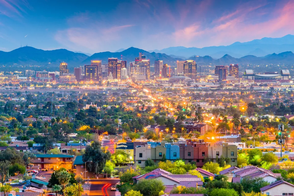 Phoenix skyline at sunset seen across the surrounding neighborhoods